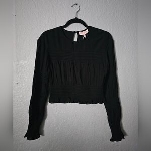 The Leyden Women's Smocked Long Sleeve Top in Black, Size Small, is a stylish an